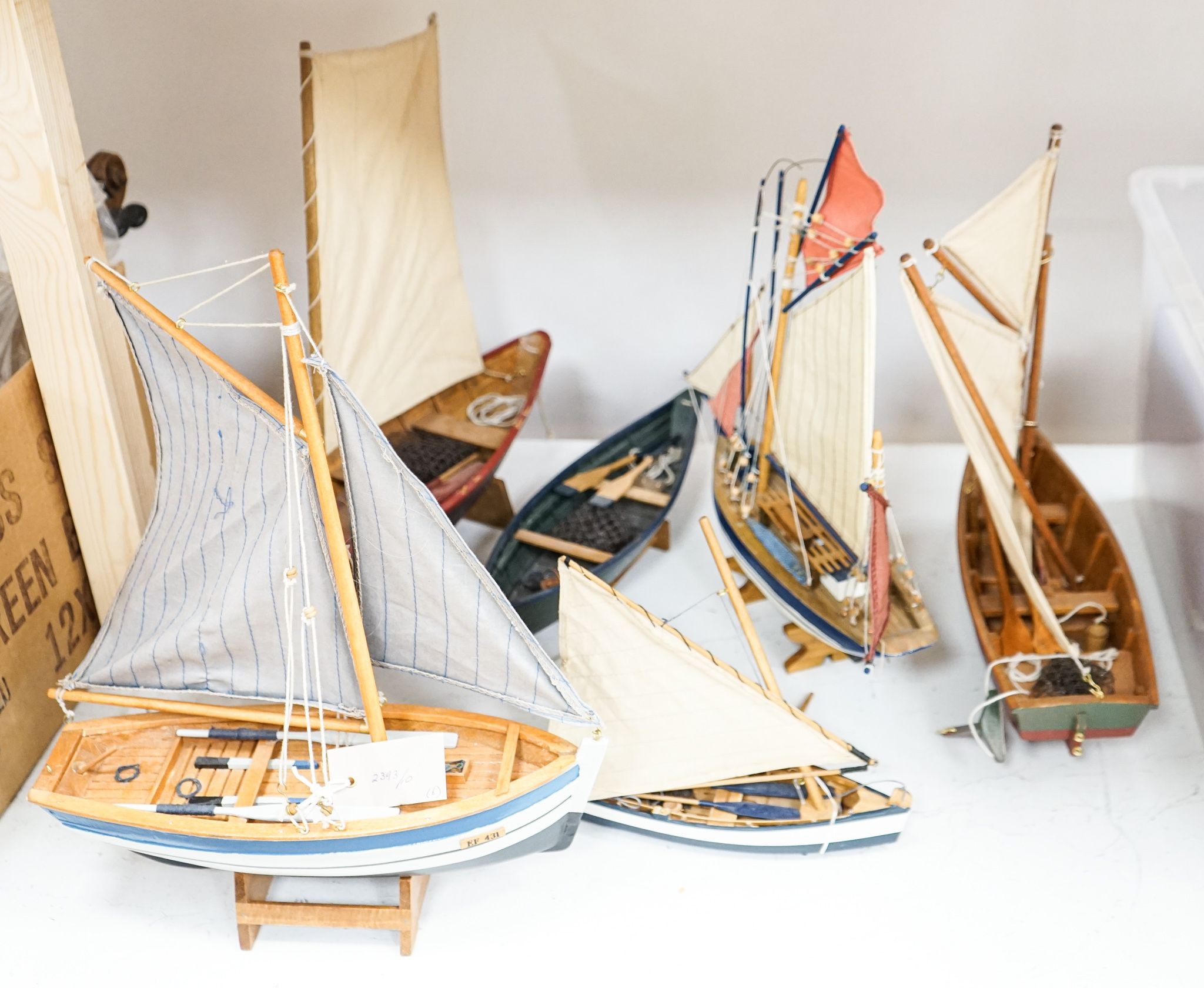 A group of six painted wood boat models